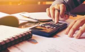 woman using calculator