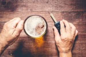 Top view of alcohol and car key