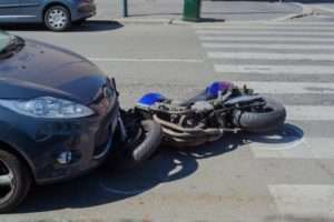 Motorcycle hit by car