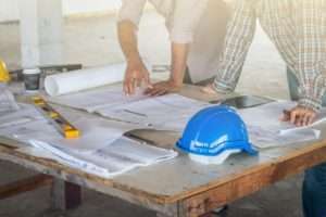 Men with blueprints