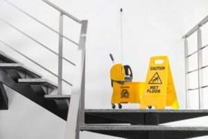 Wet floor sign on stairs