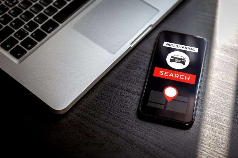 rideshare app with laptop