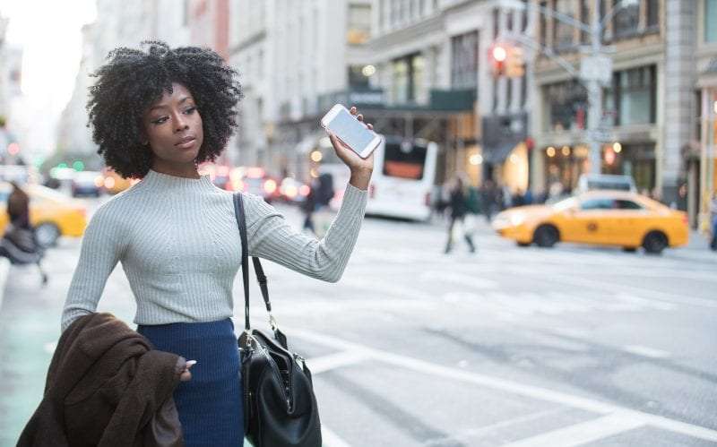 young woman calling rideshare