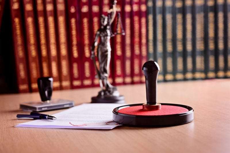 Justice scale with legal documents