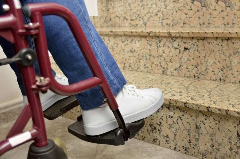 Paralyzed person at steps