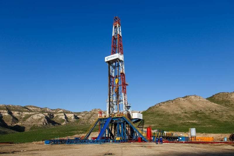 oil rig by hills