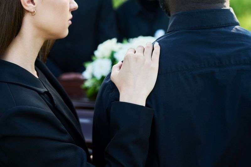 mourning couple at funeral