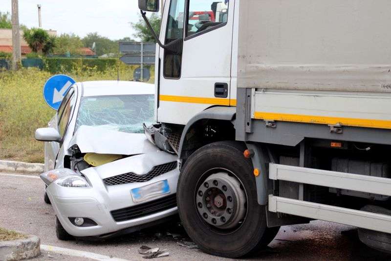 semi truck hitting front of car