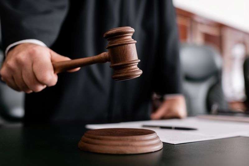 judge standing with gavel