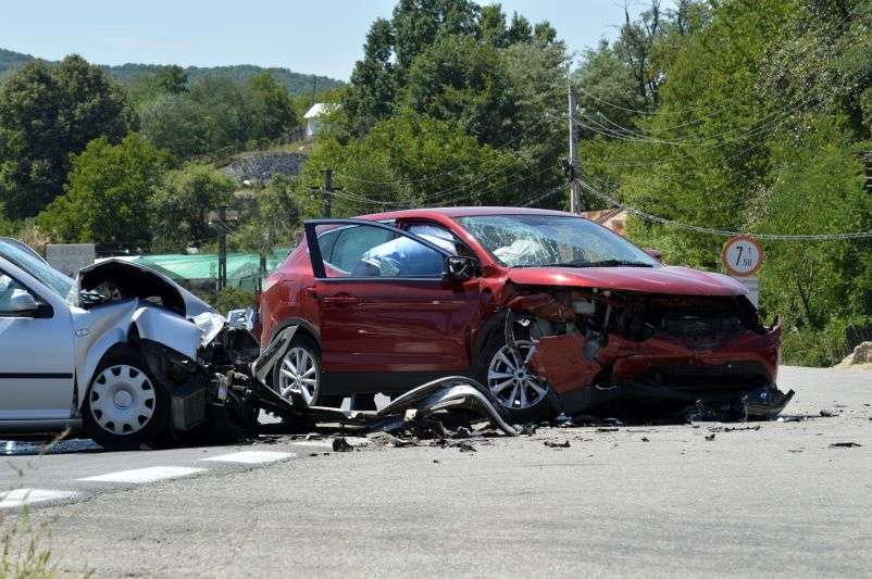 two wrecked cars in countryside
