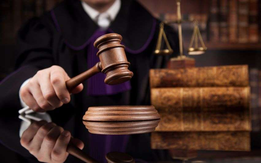 judicial gavel with books