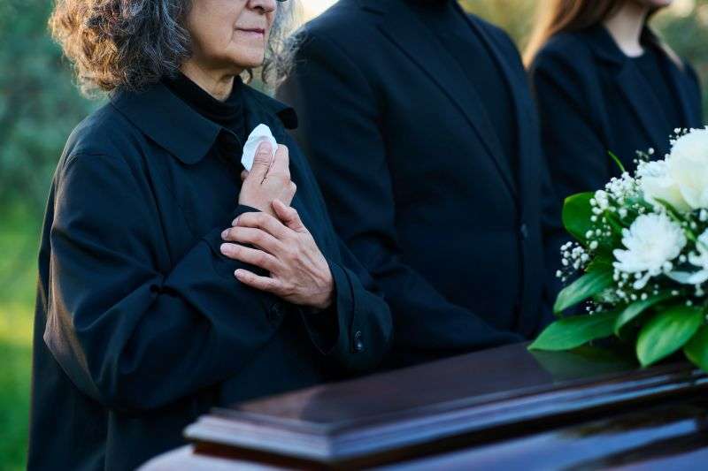 mourning woman with others